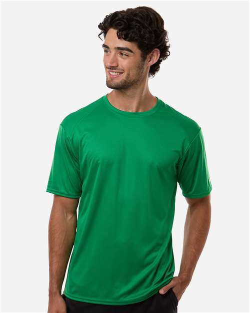 Man wearing a kelly green performance shirt