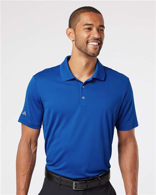 Man wearing a royal blue performance polo